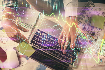 Double exposure of man and woman working together and forex graph hologram drawing. Financial analysis concept. Computer background. Top View.