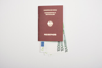 Close up shot of biometric passport with currency.