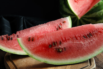 Yummy watermelon slices on wooden table, closeup