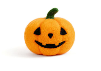 Halloween pumpkin isolated on a white background. Toy Halloween pumpkin made of wool.
