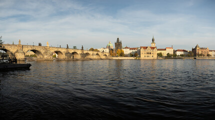 Fototapeta premium panoramic view of Charles Bridge and the Vltava River. stone bridges on the river in the city. in the center of the old town of Prague in the Czech Republic