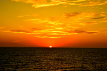 Naklejka na ściany i meble View of a wonderful sunset over the ocean