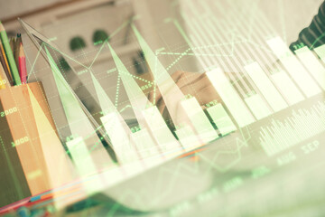 Double exposure of woman hands typing on computer and forex chart hologram drawing. Stock market invest concept.