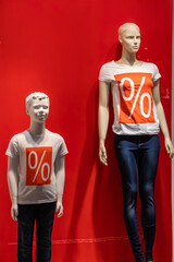 Mannequins for selling  in a shopping center. Big seasonal sale.