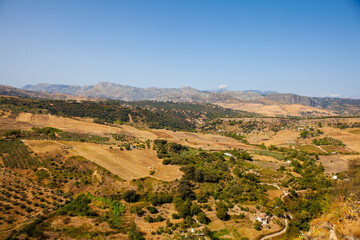 Fototapeta na wymiar Andalusia landscape, countryside road and rock in Ronda, Andalusia, Spain.