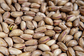 Background of pistachio nuts. Flat layout. Nuts close up