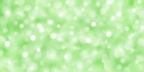 Abstract background of big and small translucent circles in green colors with bokeh effect