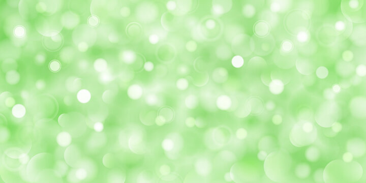 Abstract background of big and small translucent circles in green colors with bokeh effect