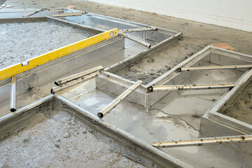  Installing gutters drain kitchen floor restaurant . Construction work.