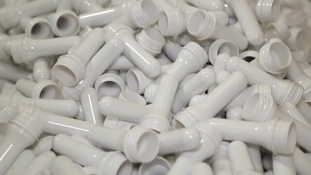 production line of mineral water and carbonated drinks. Plastic packaging. preform