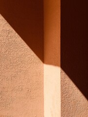 Orange texture wall with graphic shadow