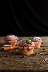 Christmas muffins on a wooden board on a dark background with a place under the text