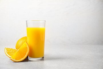 Freshly made orange juice on light table. Space for text
