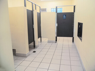 Public Restroom with 3 Stalls and a Handicap Bathroom