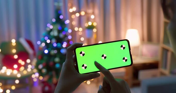 woman play green screen smartphone