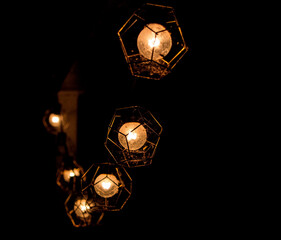 Fototapeta na wymiar Vintage String of Lights Single Light with Black Background