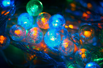Spherical led lights close-up. Christmas garland glowing in the dark