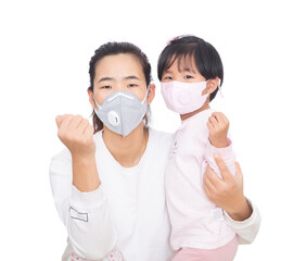 Mother and daughter wearing masks make cheering gestures together