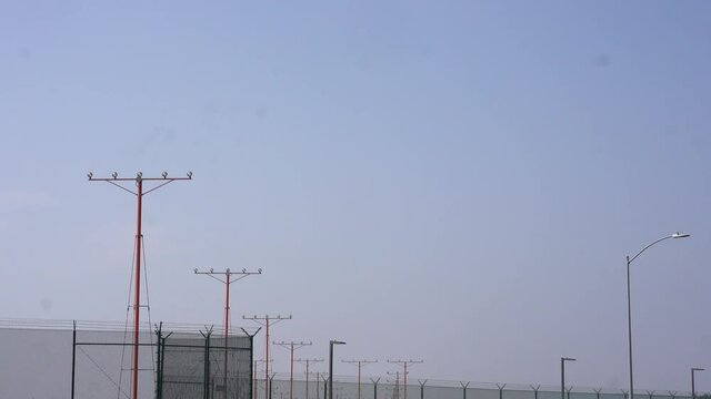 Airplane touching down on runway after flight
