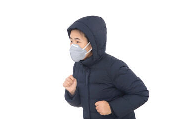 A lady wearing a down jacket and a mask is running