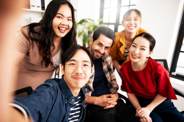 Selfie of group young man and woman team smiling having fun together