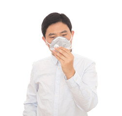A man wearing a mask is checking a mercury thermometer