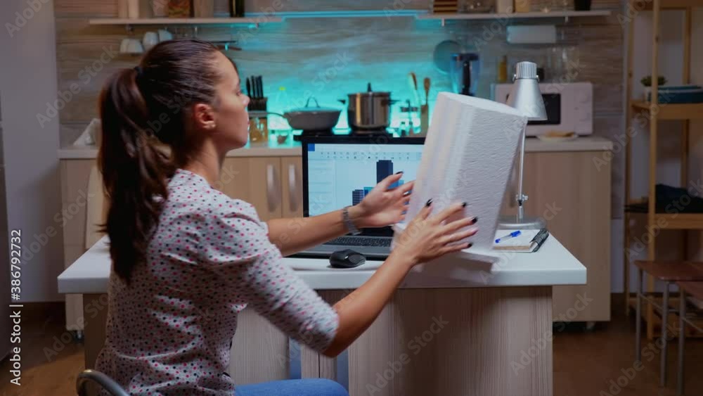 Poster woman architect matching prototype with plans from laptop working from home overtime. designer using