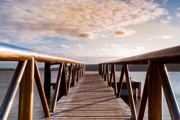 Obraz premium Photograph of an old pier with scenery and sunset