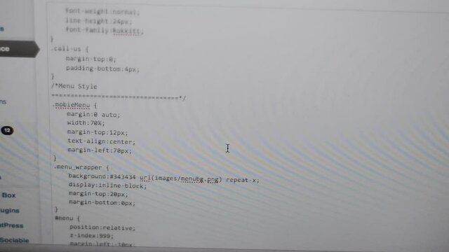Scrolling through a page of css on a web developers computer screen