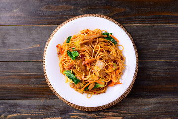 Asian food, vegetarian stir fried noodles with mushroom and vegetables, Top view