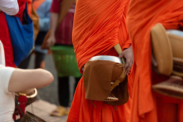 Fototapeta na wymiar Buddhist monks on everyday morning traditional alms giving in Luang Prabang, Laos.