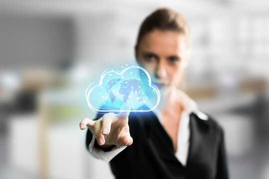 businesswoman interacting with a virtual cloud in front of an office background