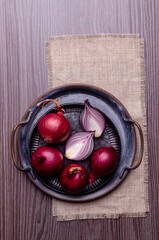 Raw red onion in a metal plate