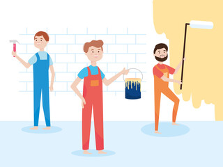 team workers wall remodeling with paint roller, bucket and hammer remodeling