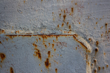 Texture of a rusty gray metal surface with traces of welding. Background