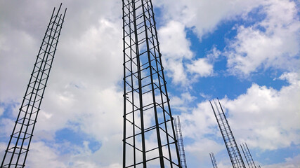 high concrete irons in a construction site with blue sky background. frog eye angle photo