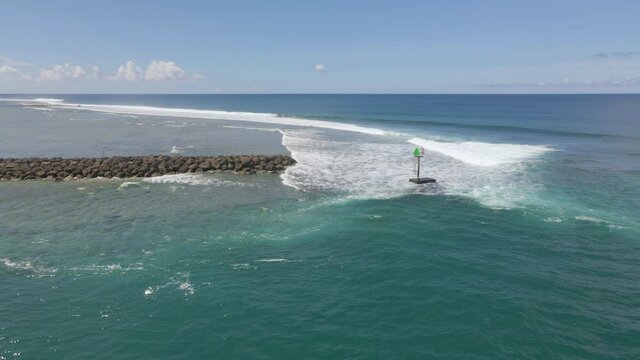 Drone circling around green marker at Hagatna Boat Basin in Guam USA