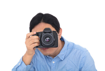 Male photographer holding a camera to take pictures in front of white background