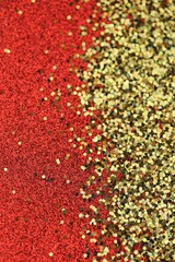 Christmas shining red gold glitter background.Shiny holiday texture. Wallpaper phone shining glitter.New Year and Christmas background.  glitter macro background with shining bokeh
