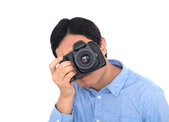 Male photographer holding a camera to take pictures in front of white background