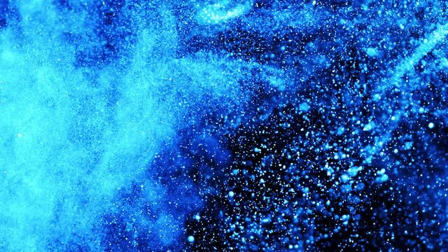 Gold dust particles fly in slow motion in the air lingering slowly. Dust Particles Background Bokeh Lights Background on Black Background 4k Footage Snow Particles Background.