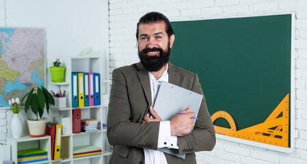 Going back to class. happy man with beard holding notebook. workbook for studying. informal...