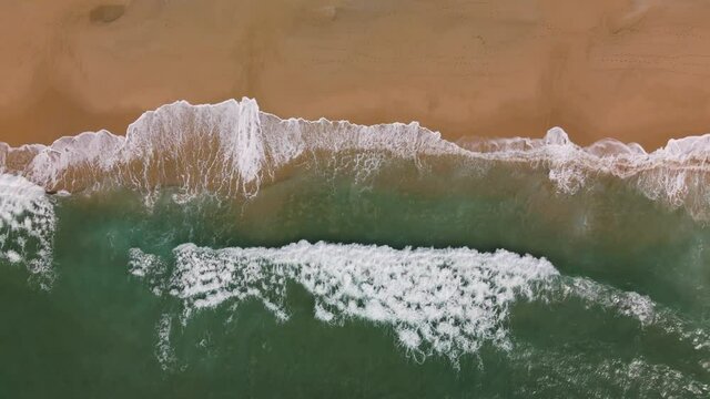 Ocean Waves Rolling And Coming On A Sand Beach. Aerial Top Down Shot, 4K