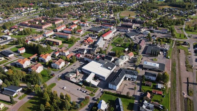 Vehicles Driving Along The Road Of Malung On A Sunny Day In Dalarna, Sweden. - aerial drone shot