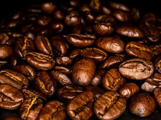 Closeup group of roasted coffee beans background