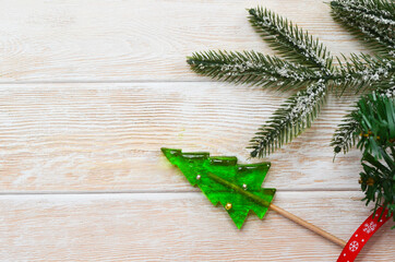 Sweet homemade christmas tree shaped lollipops, children's holiday sweets and dessert, new year's food concept, funny kid's candies