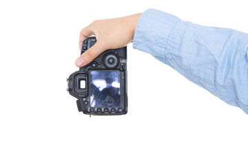 Hand holding black SLR camera close-up