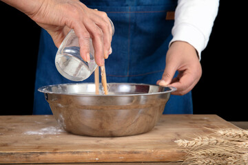 The chef is making noodles