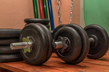 Metal dumbbells for weightlifting. Sports equipment.