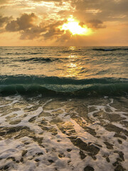 Breathtaking sunrise over the Ocean seen from sandy beach in North Miami or South Beach with...